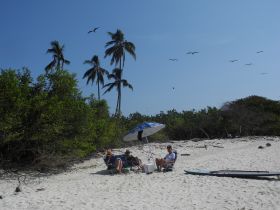 People sitting on the beach in Playa Venao, Pedasi, Azuero Peninsula Panama – Best Places In The World To Retire – International Living